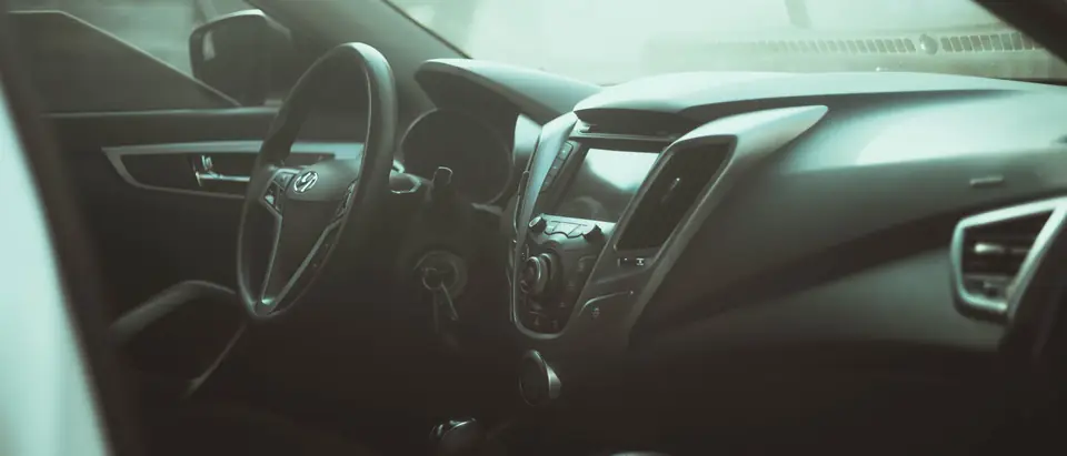 Dashboard and steering wheel in soft window light